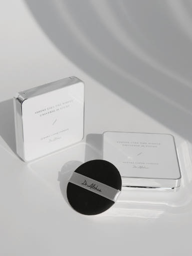ProtoClinical k-beauty gray beauty graphic with a dark rounded center and pale side panels on a light background.
