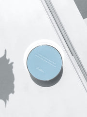 ProtoClinical k-beauty blue and gray beauty graphic with a centered soft-edged form and peach side shading on a light background.