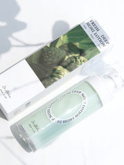 ProtoClinical k-beauty soft gray beauty graphic with a centered blurred oval form on a light background.
