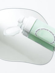 ProtoClinical k-beauty pastel pink and mint beauty graphic with a centered soft gray-green form on a light background.
