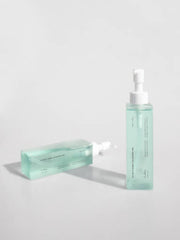 ProtoClinical k-beauty pale blue beauty graphic with a centered horizontal gray band on a light background.