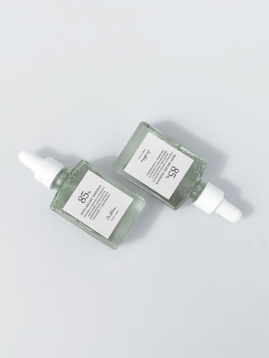 ProtoClinical k-beauty soft gray beauty graphic with a centered horizontal band on a pale background.