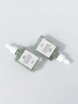 ProtoClinical k-beauty soft gray beauty graphic with a centered horizontal band on a pale background.