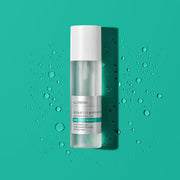 ProtoClinical k-beauty ILLIYOON Cica Trouble Clear Body Mist 200ml shown as a clear spray bottle with a white cap centered on a teal background with scattered water droplets