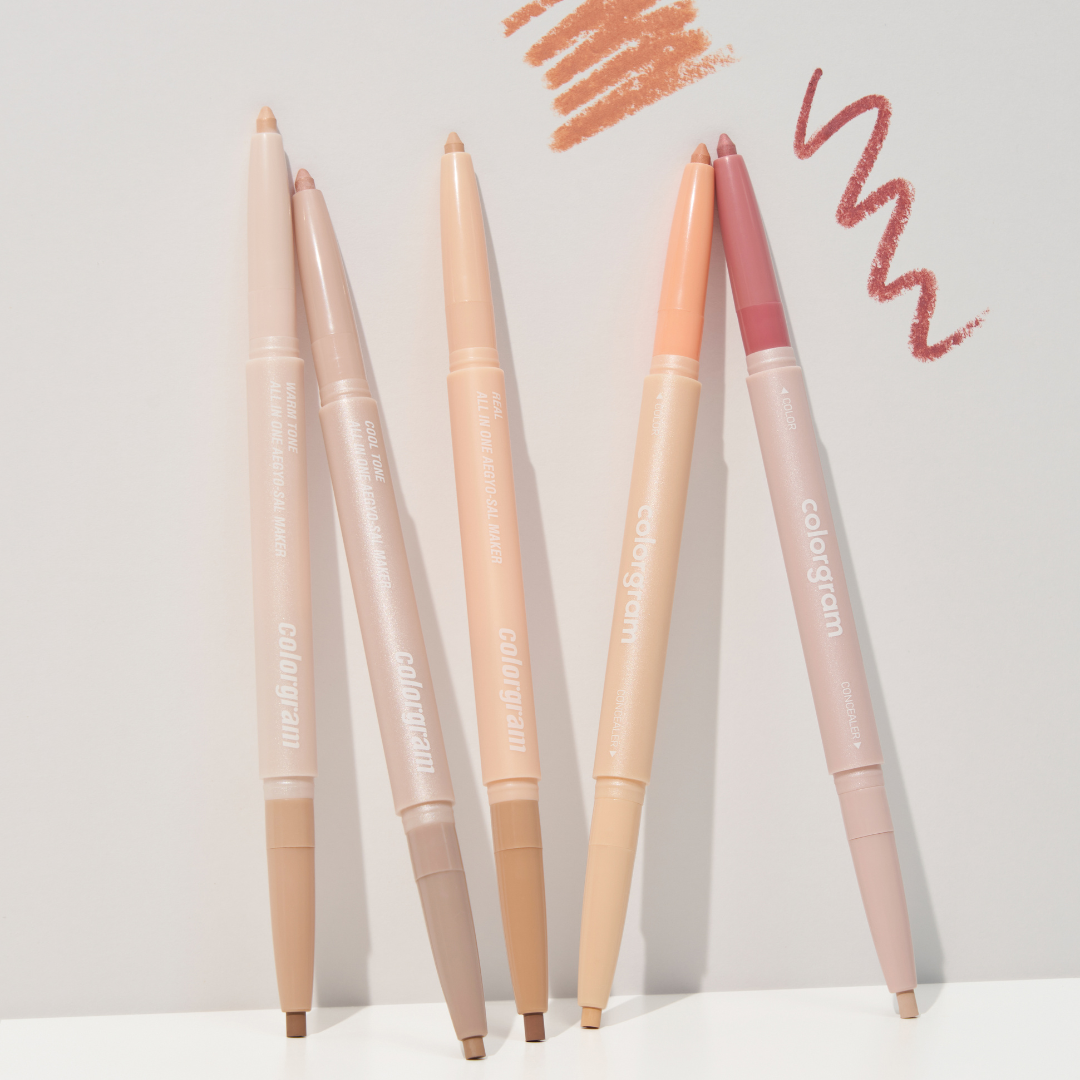 ProtoClinical k-beauty colorgram All In One Aegyo-Sal Maker 0.35g single slim undereye maker package standing upright with a beige upper section and dark brown lower section on a pale cream and pink background