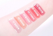 ProtoClinical k-beauty colorgram Fruity Glass Gloss 3g pale pink horizontal gloss swatch with a rose center area and light blue corner on a wide white graphic