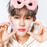 ProtoClinical k-beauty product packaging with a purple center on a light cream background.
