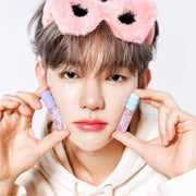 ProtoClinical k-beauty product packaging with a purple center on a light cream background.