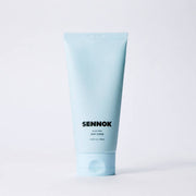 ProtoClinical k-beauty pale blue beauty bottle silhouette on a soft light background.