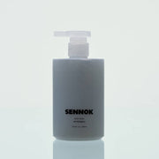 SENNOK Body Wash After Bath 300ml by ProtoClinical shown as a dark body wash bottle silhouette on a soft white background for a k-beauty body care product.