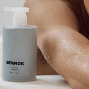ProtoClinical k-beauty SENNOK Body Wash After Bath 300ml body wash bottle silhouette on a soft light background.