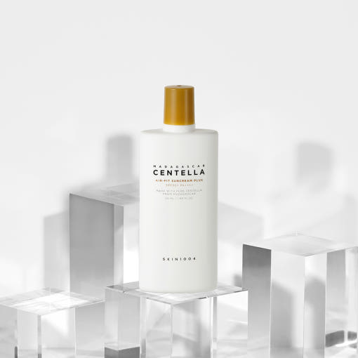 ProtoClinical k-beauty SKIN1004: Madagascar Centella Air-fit Suncream Plus Spf50+ Pa (50ml) single pale cream package silhouette with soft green and blue side accents on a light background.