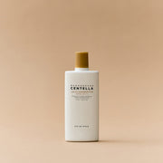 ProtoClinical k-beauty SKIN1004: Madagascar Centella Air-fit Suncream Plus Spf50+ Pa (50ml) single warm beige package silhouette with a muted olive center on a light background.