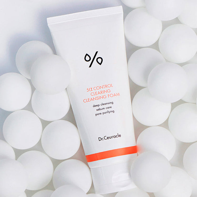 ProtoClinical k-beauty Dr.Ceuracle 5α Control Clearing Cleansing Foam 200ml white cleansing foam tube placed diagonally among round white spheres on a bright white background