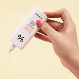 ProtoClinical k-beauty Dr.Ceuracle 5α Control No Sebum Sun Lotion SPF50+ PA++++ 50ml white sun lotion bottle held in a hand with pink nails dispensing cream onto skin on a pale yellow background