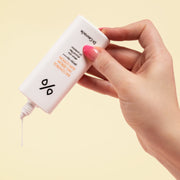ProtoClinical k-beauty Dr.Ceuracle 5α Control No Sebum Sun Lotion SPF50+ PA++++ 50ml white sun lotion bottle held in a hand with pink nails dispensing cream onto skin on a pale yellow background