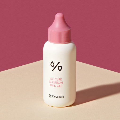 ProtoClinical k-beauty Dr.Ceuracle AC Care Solution Pink Gel 50ml single centered pale pink gel package on a deep pink and beige background.