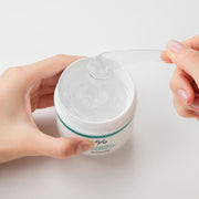 ProtoClinical k-beauty Dr.Ceuracle Cica Regen 95 Soothing Gel 110g open white gel jar held in two hands with a clear spatula lifting translucent gel on a pale background