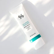 ProtoClinical k-beauty Dr.Ceuracle Cica Regen Vegan Sun SPF50+ PA++++ 50ml angled white sunscreen tube with a teal band on a sunlit white surface with soft window shadows