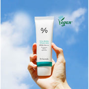 ProtoClinical k-beauty Dr.Ceuracle Cica Regen Vegan Sun SPF50+ PA++++ 50ml white sunscreen tube with a teal band held upright in a hand against a blue sky background
