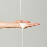 ProtoClinical k-beauty pale green and beige beauty graphic with a soft peach lower band on a light background.