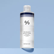 ProtoClinical k-beauty Dr.Ceuracle Pro Balance Biotics Toner 300ml single upright white toner bottle centered on a pale blue background with deeper blue side shading