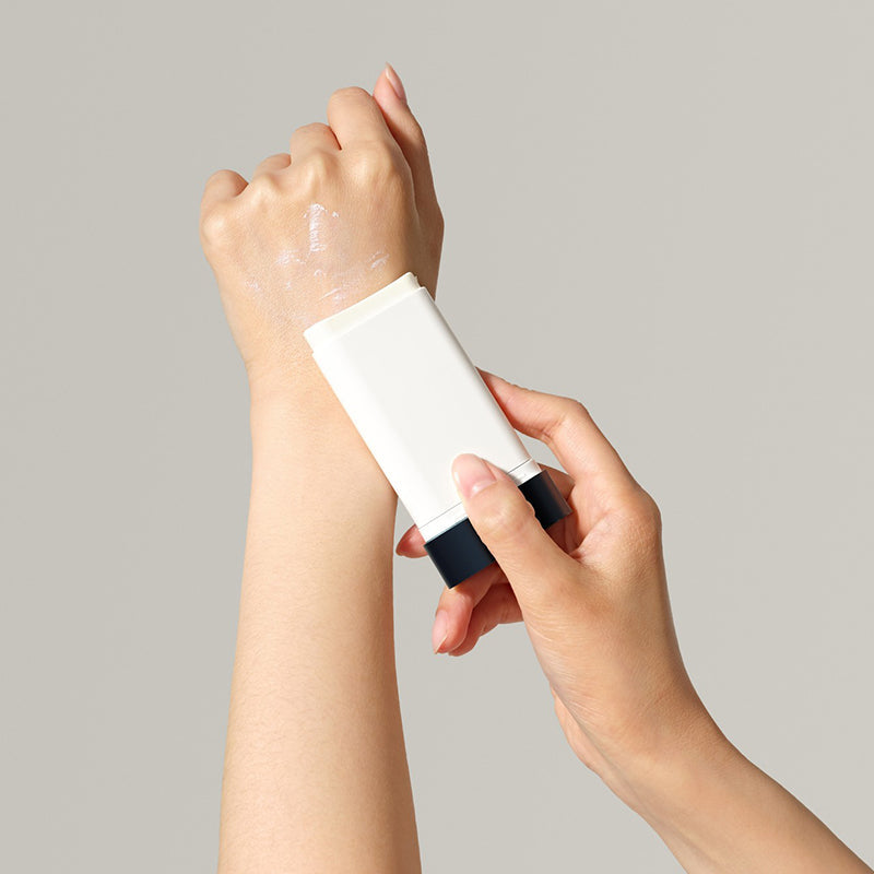 ProtoClinical k-beauty soft beige beauty graphic with a muted gray upper band on a pale background.