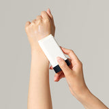 ProtoClinical k-beauty soft beige beauty graphic with a muted gray upper band on a pale background.