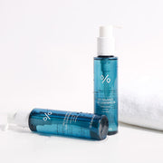 ProtoClinical k-beauty abstract pale pink and blue beauty graphic with a dark blue band along the lower edge.