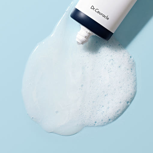 ProtoClinical k-beauty abstract light blue beauty graphic with a soft dark gray shape near the upper right.