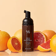 ProtoClinical k-beauty Dr.Ceuracle Pure VC Mellight Boosting Essence 145ml single centered amber essence bottle on a warm orange background with a pale cream lower band