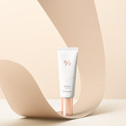 ProtoClinical k-beauty warm beige beauty graphic with a soft diagonal cream band and muted gray lower shading.