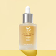 ProtoClinical k-beauty Dr.Ceuracle Royal Vita Propolis 33 Ampoule 30ml single upright amber ampoule bottle centered on a warm beige background with a pale yellow lower band