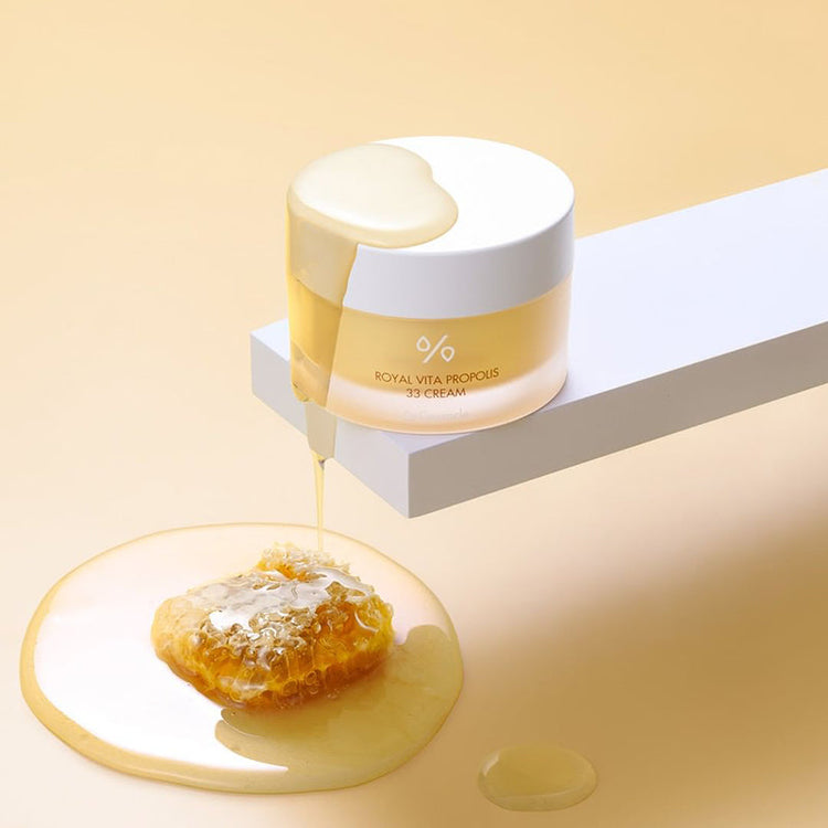 ProtoClinical k-beauty cream and tan beauty graphic with layered horizontal bands and a soft dark center accent.