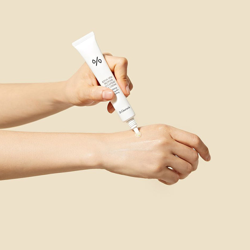 ProtoClinical k-beauty warm beige beauty graphic with a soft brown accent near the lower right on a light background.