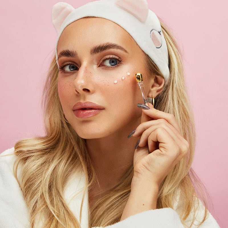 ProtoClinical k-beauty warm beige and pink beauty graphic with a soft brown vertical center form on a light background.