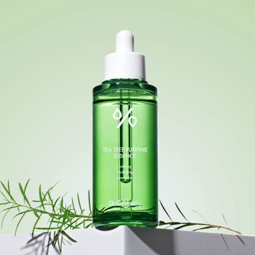 ProtoClinical k-beauty Dr.Ceuracle Tea Tree Purifine 95 Essence 50ml single upright green essence bottle centered on a soft green and blue background