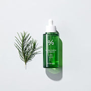 ProtoClinical k-beauty Dr.Ceuracle Tea Tree Purifine 95 Essence 50ml green essence bottle and matching carton side by side on a white background with soft lavender side panels