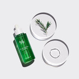 ProtoClinical k-beauty Dr.Ceuracle Tea Tree Purifine 95 Essence 50ml single upright green essence bottle centered on a pale blue background with soft blush side panels