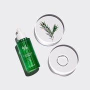 ProtoClinical k-beauty Dr.Ceuracle Tea Tree Purifine 95 Essence 50ml single upright green essence bottle centered on a pale blue background with soft blush side panels