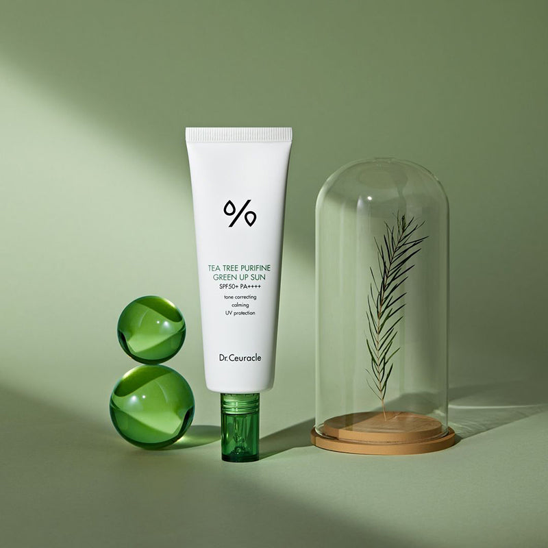 ProtoClinical k-beauty Dr.Ceuracle Tea Tree Purifine Green Up Sun SPF50 PA++++ 50ml single centered pale green sunscreen package on an olive green background.