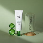 ProtoClinical k-beauty Dr.Ceuracle Tea Tree Purifine Green Up Sun SPF50 PA++++ 50ml single centered pale green sunscreen package on an olive green background.