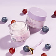 ProtoClinical k-beauty abstract lilac and cream skincare graphic with two soft vertical plum forms on a light background.