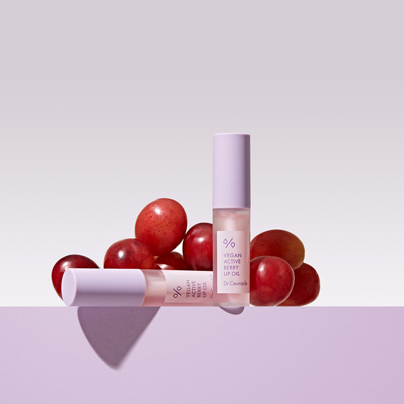 ProtoClinical k-beauty Dr.Ceuracle Vegan Active Berry Lip Oil 4.5ml three berry-toned lip oil bottles side by side on a pastel blue and pink background