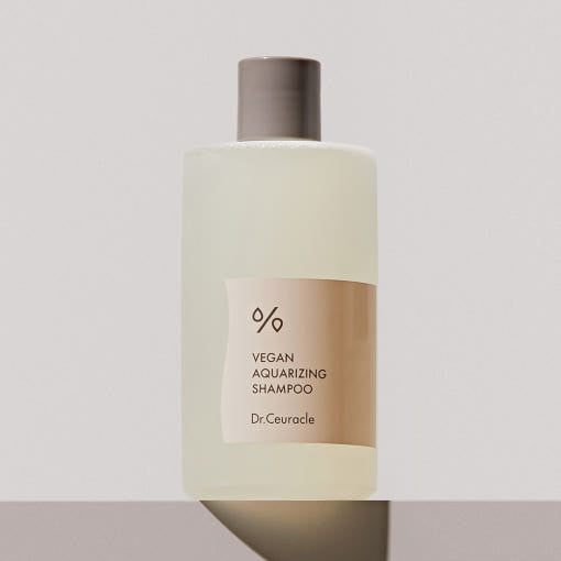 ProtoClinical k-beauty abstract beige and gray skincare graphic with two dark blurred vertical forms on a light background.