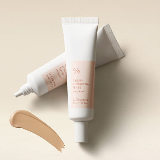 ProtoClinical k-beauty Dr.Ceuracle Vegan Kombucha Tea BB SPF30 PA++ 30m abstract beige and gray skincare graphic with two soft vertical blurred forms on a light background.