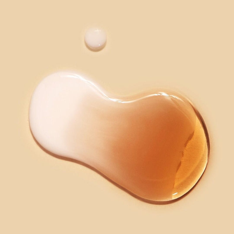ProtoClinical k-beauty pale gold beauty graphic with a soft dark centered circle on a light background.