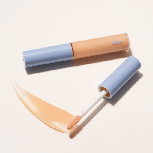 ProtoClinical k-beauty BBIA Last Eye Primer 5g single beige primer tube lying horizontally on a warm peach background