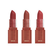 ProtoClinical k-beauty BBIA Last Powder Lipstick 3.5g three rosy nude lipstick tubes standing side by side with a soft pink center tone on a pale blue background