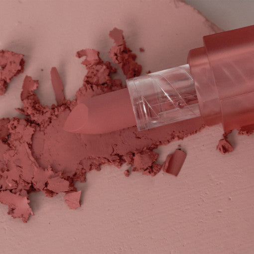 ProtoClinical k-beauty BBIA Last Powder Lipstick 3.5g close-up of a rosy nude lipstick bullet resting in matching pink powder on a pale blush background